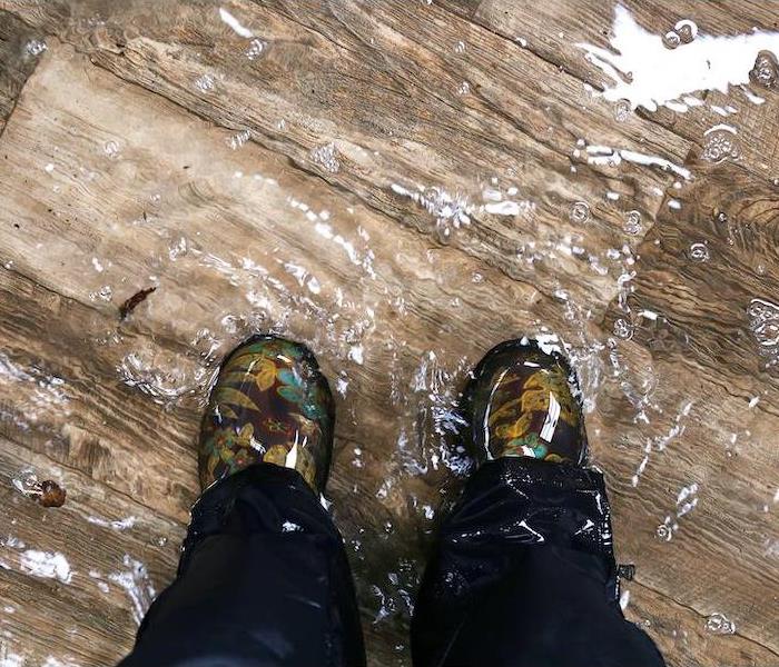 standing in a pool of storm water in home