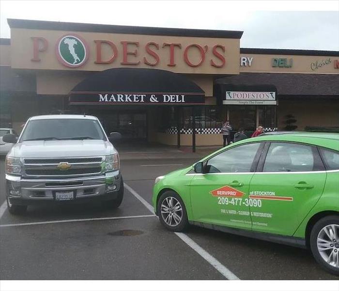 SERVPRO vehicle parked in front of business