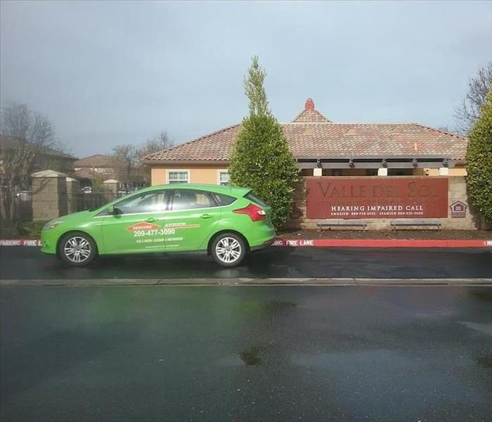 SERVPRO vehicle outside job site.